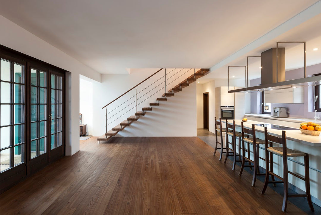 dark colored hardwood flooring installed in kitchen area
