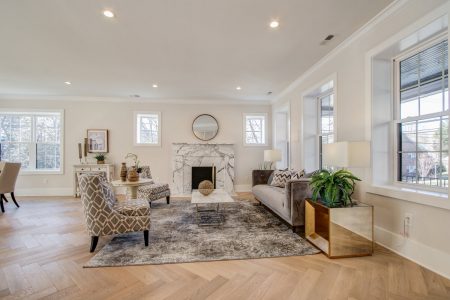 A straight on view of a living room with hardwood floors